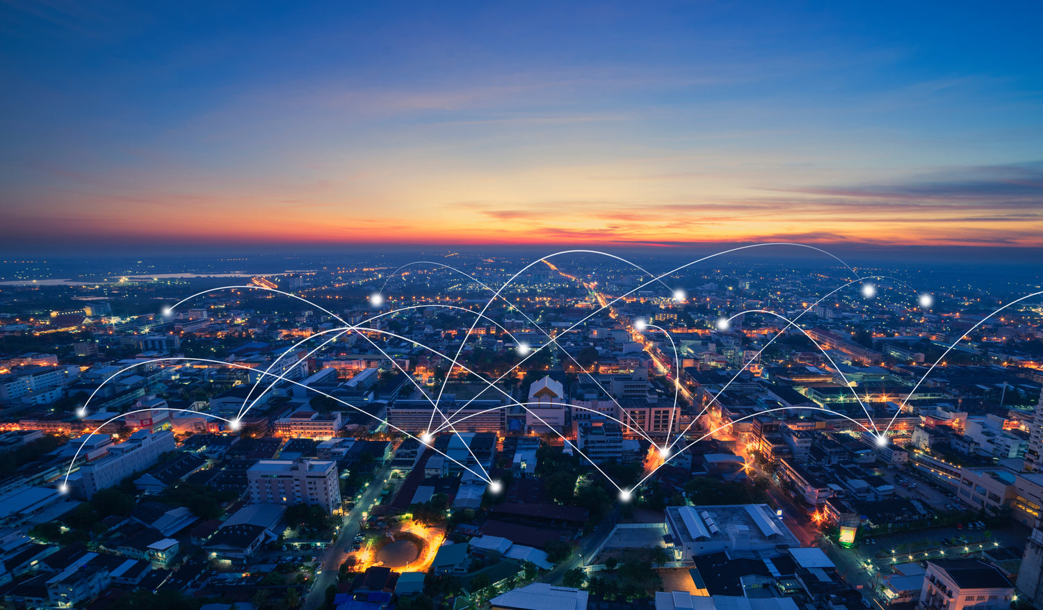 City with evening lighting at sunset.