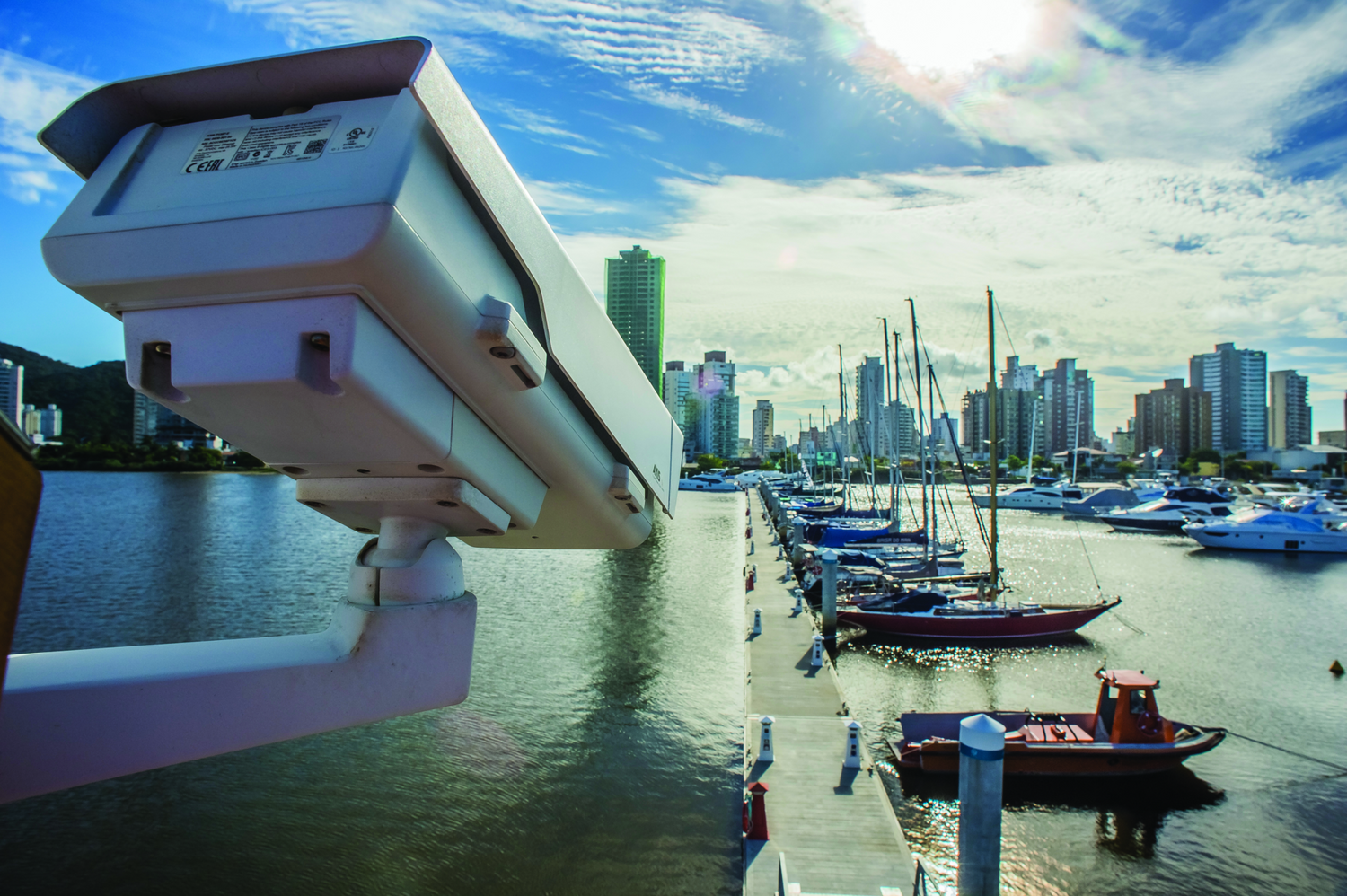Outdoor camera facing harbor and boats.