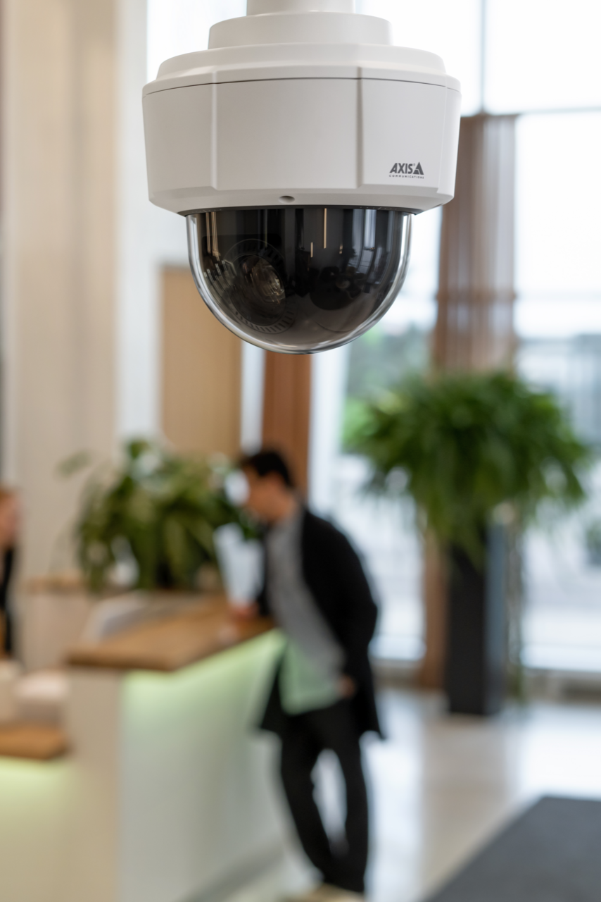 Cieling mounted M5526e camera mounted in office setting.