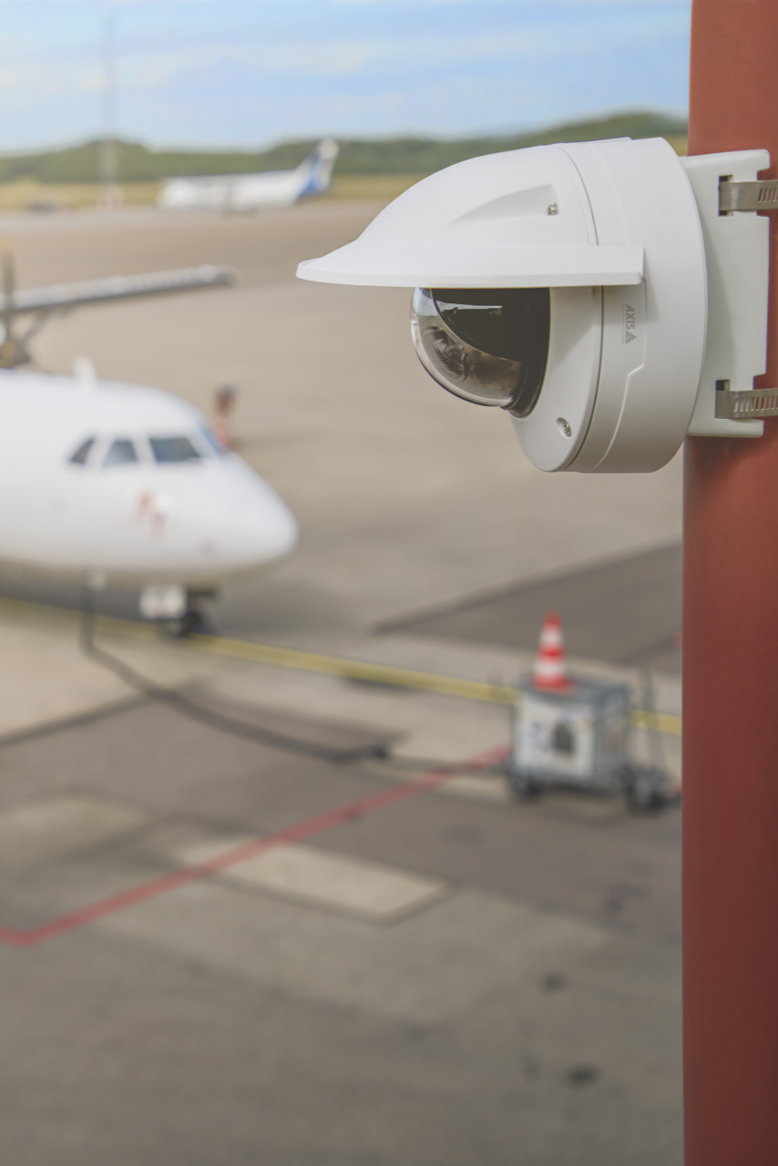 Q3536 camera pole mounted with airport tarmac in background.